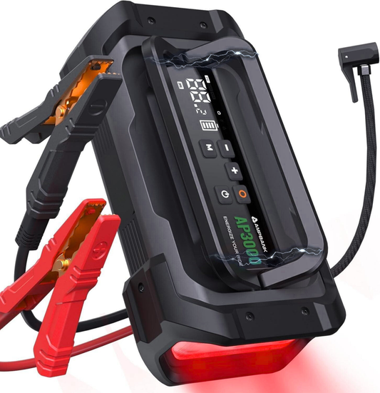 Black and red jump starter with clamps on a white background